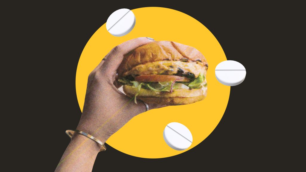 Hamburger entouré de comprimés blancs, photomontage
